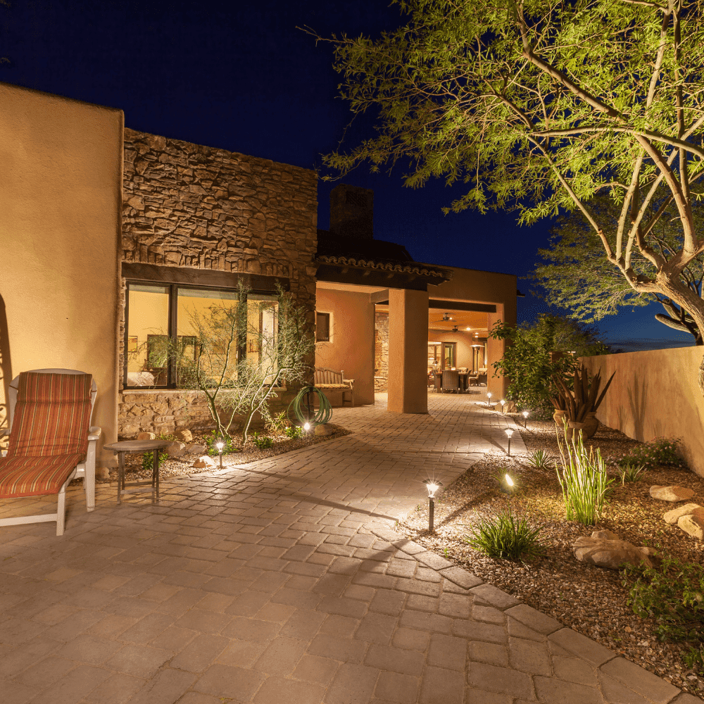 Landscape lighting installed on a commercial property (nighttime visibility).